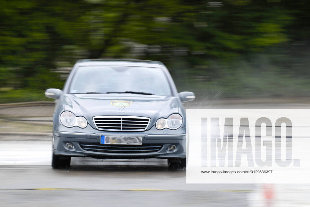 Safe driving training on wet street, Germany BLWS649449