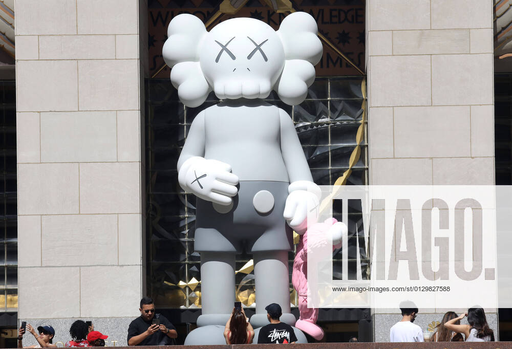 A view of the new 18-foot tall sculpture KAWS: Share by artist KAWS aka Brian Donnelly. The sculpture depicts KAW s Mickey Mouse-like Companion and a BFF smaller Elmo like character, seen at Rockefeller Center. New York USA - ZUMAk03_ 20210816_zaf_k03_009