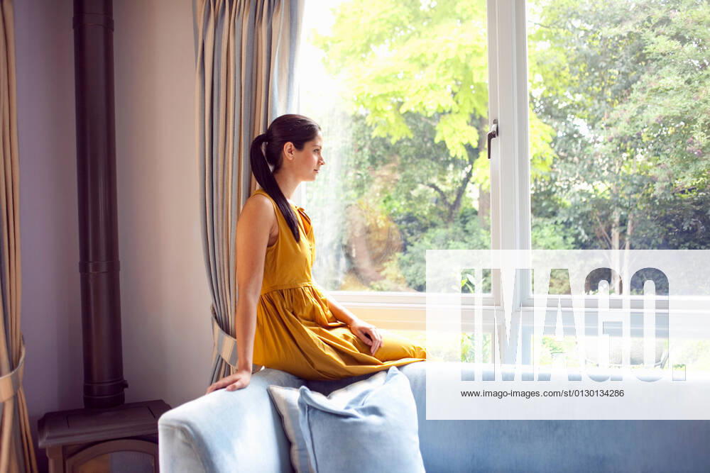 Woman sitting by window indoors RM, Mark John, 08 05 2011, 06 01 2012,