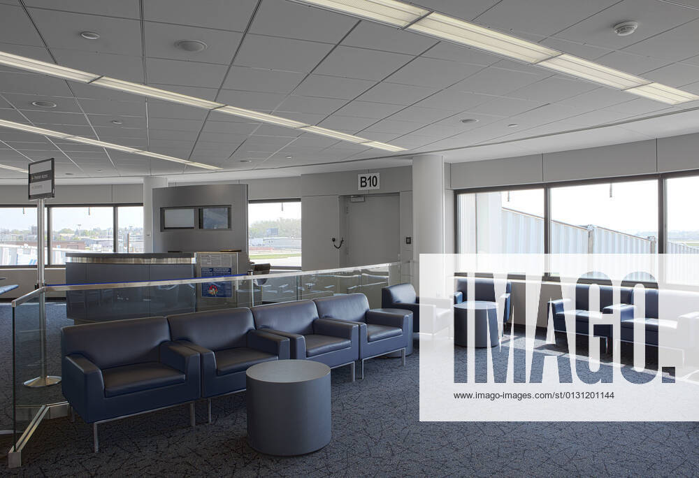 Empty airport lounge, with seats and windows, a departure gate lounge. Rochester,United States,Empty airport lounge, with seats and windows, a departure gate lounge. Empty airport lounge, with seats and windows, a departure gate lounge.