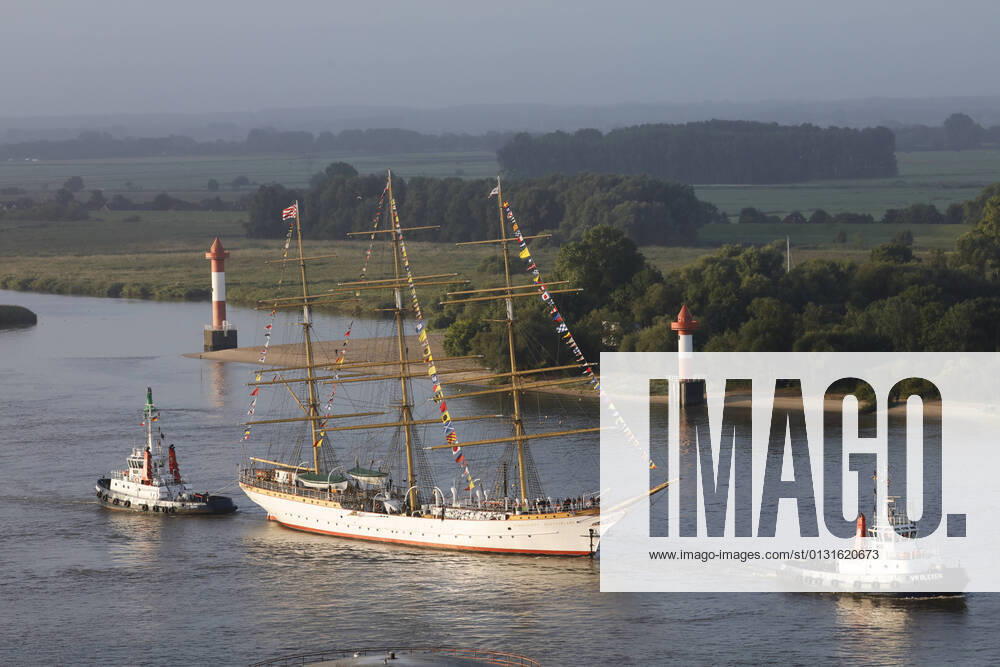 Three-master SCHULSCHIFF DEUTSCHLAND is towed by two tugs on the Weser from Bremen to Bremerhaven, where the last German full-rigged ship will be moored in the New Harbour of the Havenwelten as a museum ship.