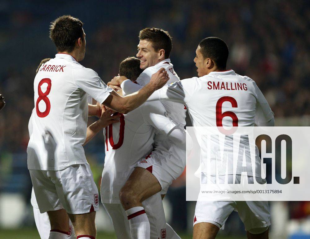 England s Steven Gerrard celebrates with goalscorer Wayne Rooney..Montenegro v England- World Cup Qualifier - Podgorica City Stadium, Podgorica- 26 03 13 - Picture David Klein Sportimage .