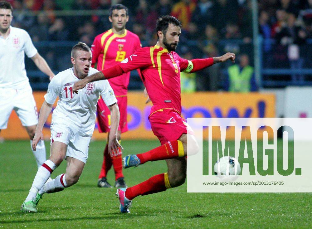 Podgorica(Montenegro) Montenegro-England FIFA world cup Brazil qualifiers men football Tom Cleverley(L) England and Mirko Vucinic(R) Montenegro :