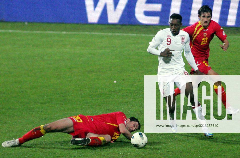 Podgorica(Montenegro) Montenegro-England FIFA world cup Brazil qualifiers men football Danny Welbeck(c) England between Miodrag Dzudovic(L) and Stefan Savic(r) Montenegro :