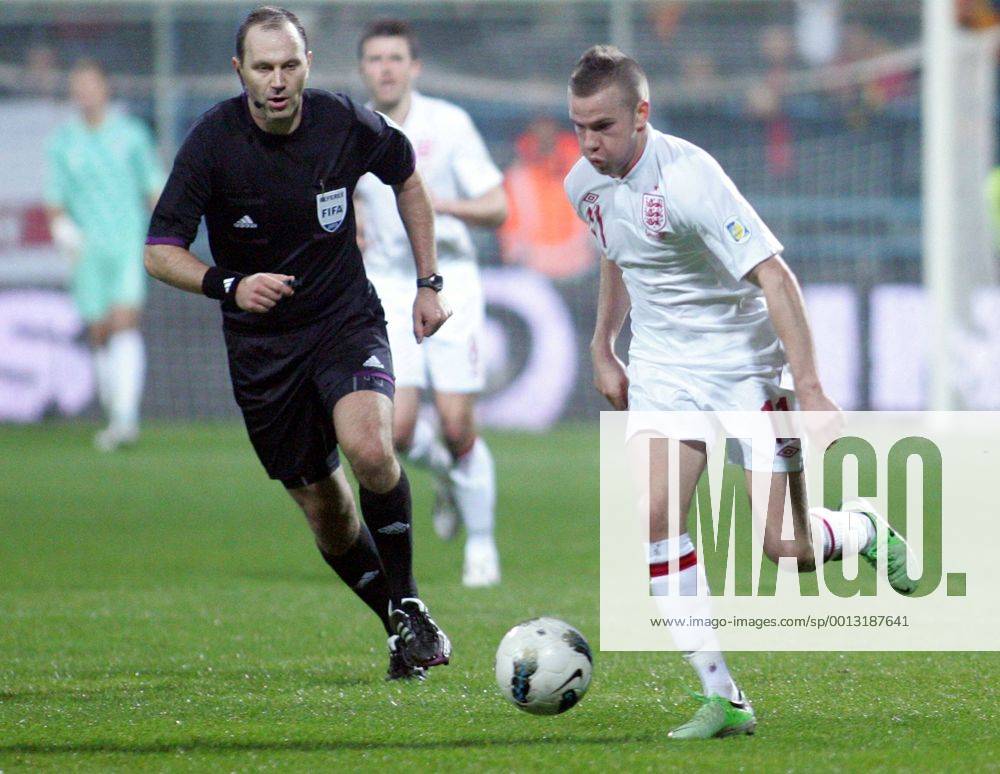 Podgorica(Montenegro) Montenegro-England FIFA world cup Brazil qualifiers men football Tom Cleverley(r) England and Jonas Eroksson(L) Swedish referee :