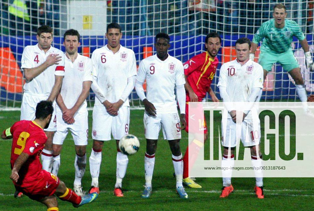 Podgorica(Montenegro) Montenegro-England FIFA world cup Brazil qualifiers men football Mirko Vucinic (Left in font) Montenegro shoot across Steven Gerrard(L),Michael Carrick(2L),Chris Smalling(3L),Danny Welbeck(4L) with Wayne Rooney(r) England and Dejan Damjanovic(5L) Montenegro :