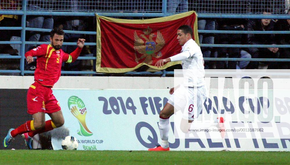 Podgorica(Montenegro) Montenegro-England FIFA world cup Brazil qualifiers men football Chris Smalling(r) England and Mirko Vucinic(L) Montenegro :