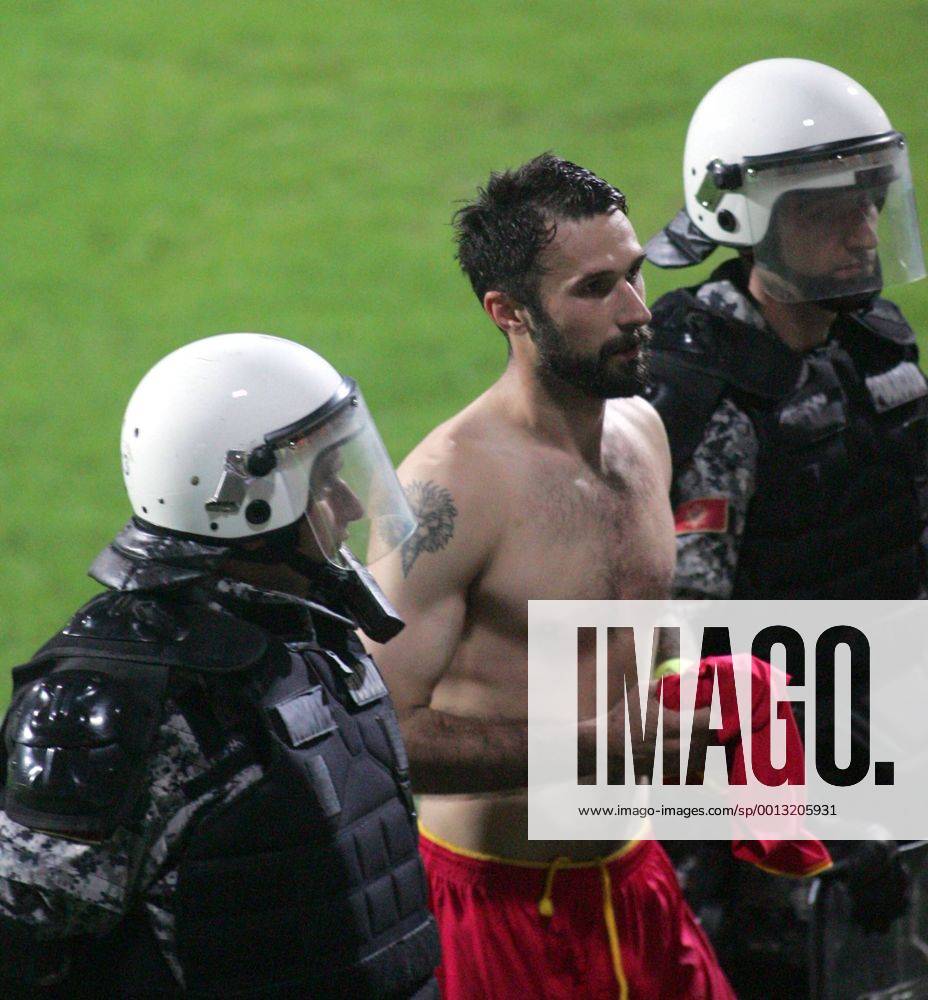 Podgorica(Montenegro) Montenegro-England FIFA world cup Brazil qualifiers men football Mirko Vucinic(c) Montenegro passing through police :