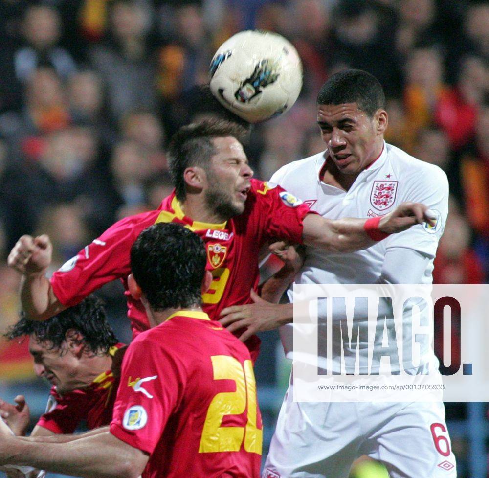 Podgorica(Montenegro) Montenegro-England FIFA world cup Brazil qualifiers men football Vladimir Bozovic(c) Montenegro and Chris Smalling(r) England :