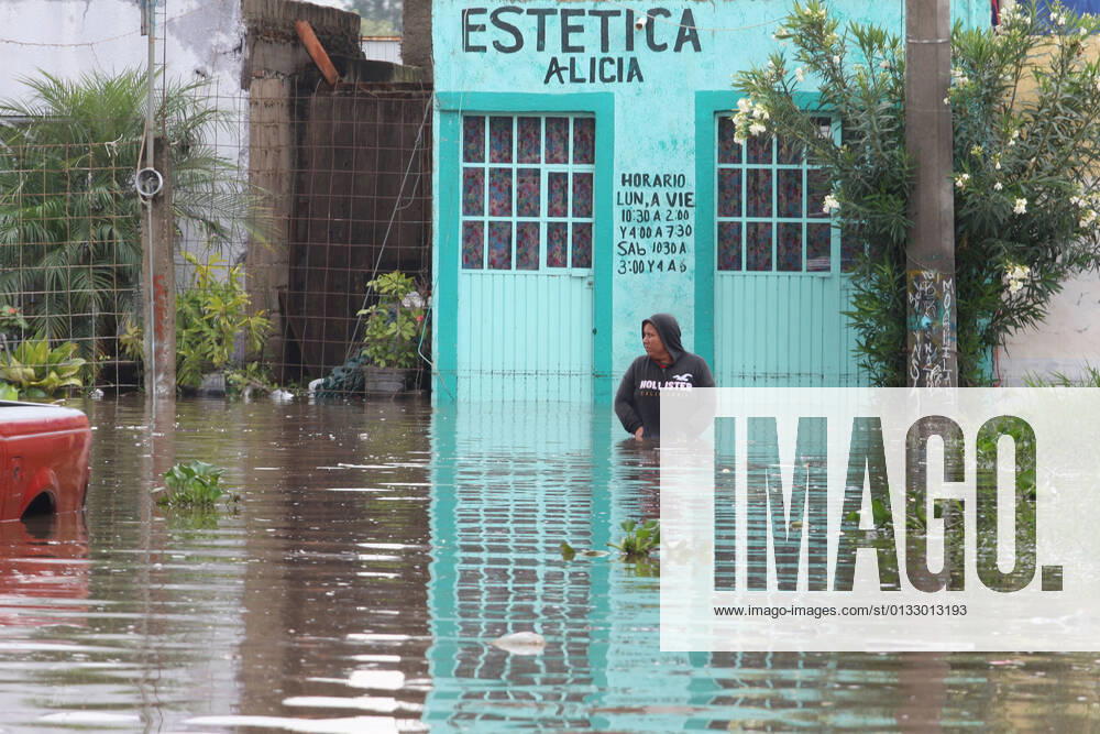 (210904) -- JALISCO, Sept. 4, 2021 -- A person is seen on a street flooded due to heavy rains, in the municipality of Tlaquepaque, State of Jalisco, Mexico, on Sept. 3, 2021. A strong storm during the early hours of Friday caused the El Chicharron and Las Pintas dams to overflow, flooding several areas of the municipality of Tlaquepaque. ) MEXICO-JALISCO-FLOOD ArturoxCampos