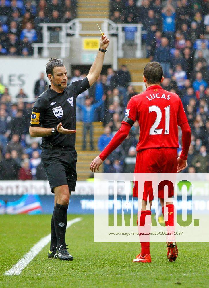 Football - 2012 2013 Premier League - Reading vs. Liverpool Referee Mr Mark Clattenburg shows the yellow card to Lucas Leiva of Liverpool