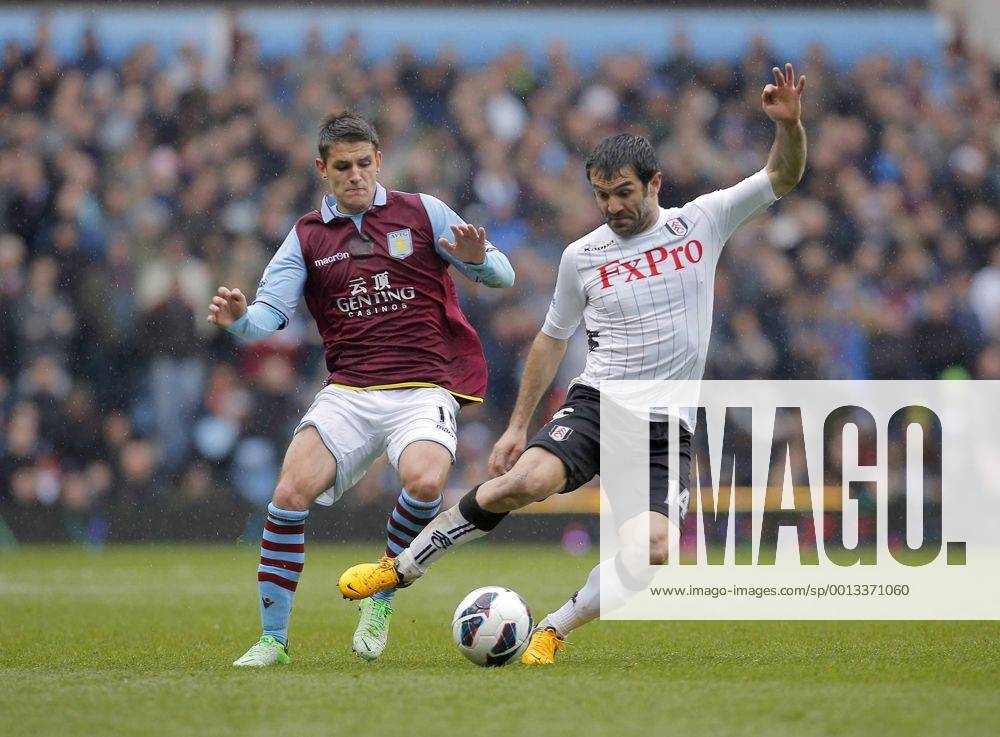 Ashley Westwood of Aston Villa (left) competes with Giorgos Karagounis of Fulham - Aston Villa vs FC Fulham - Barclays Premiership - Villa Park Birmingham - Season 12 13 - 13 4 13. .