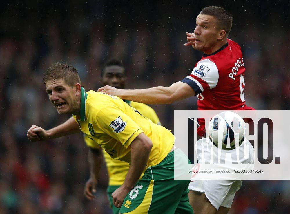 - Lukas Podolski (R) of Arsenal vies with Michael Turner of Norwich during their Barclays Premier League match at the Emirates Stadium in London, Britain, on April 13, 2013. Arsenal won 3-1. (Xinhua Wang Lili)