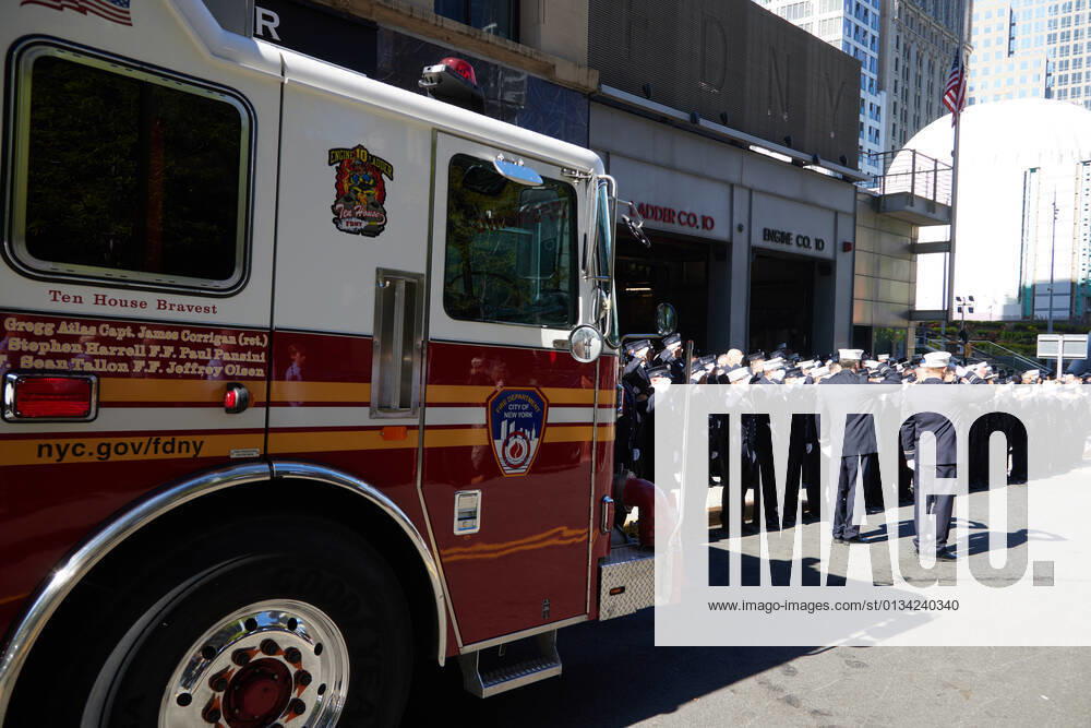 Members of FDNY Ten House, Engine Company 10 and Ladder Company 10, stand at attention in remembrance of the 343 firefighters who gave their lives on 9 11 01, on the 20th anniversary of the September 11, 2001 terrorist attack on the World Trade Center and the Pentagon in New York, New York, on Saturday, September 11, 2021 New York USA - ZUMAs152 20210911_zaa_s152_009