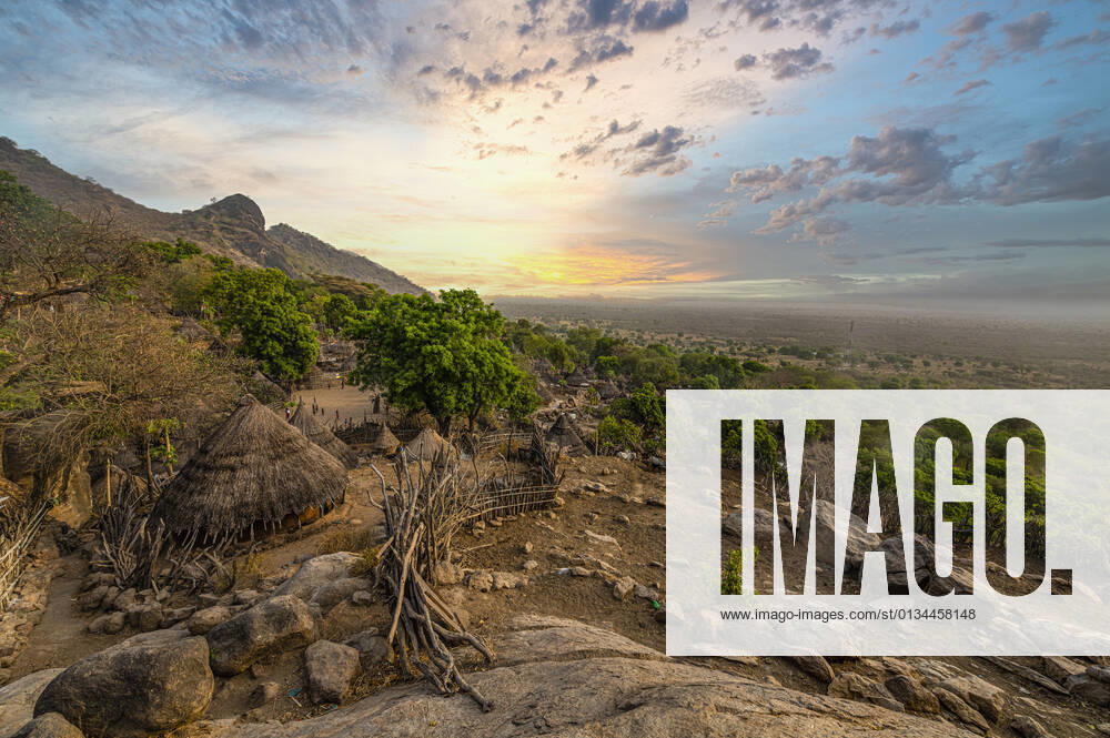 Sunset over traditional huts of the Otuho (Lotuko) tribe, Imatong mountains, Eastern Equatoria, South Sudan, Africa