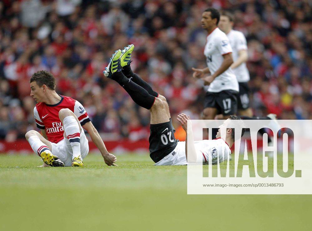 Robin van Persie on the floor following a tackle by Laurent Koscielny of FC Arsenal - Barclays Premier League - FC Arsenal vs Manchester United (ManU) - Emirates Stadium London - Season 12 13 - 28th April 2013 - .