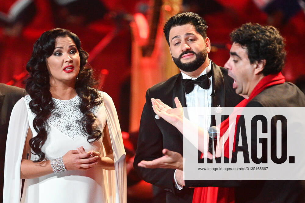 Russia Opera Singer Netrebko Anniversary 6654004 18.09.2021 From left, opera singers Anna Netrebko, Rolando Villazon and Yusif Eyvazov are seen during a concert marking Anna Netrebko s 50th birthday, at the State Kremlin Palace, Moscow, Russia. Ramil Sitdikov Sputnik Moscow Russia