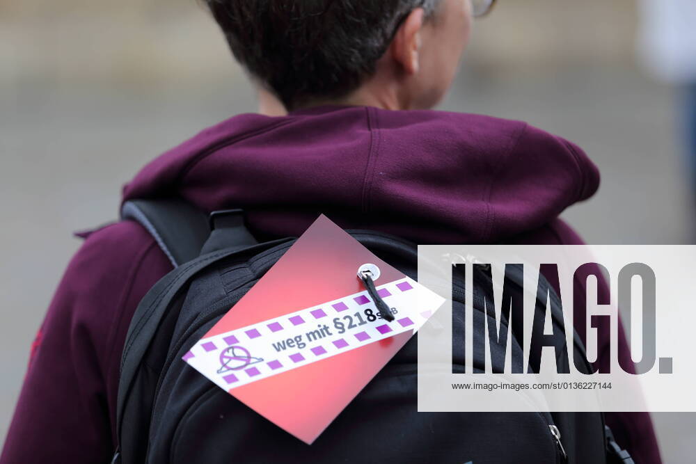 A woman holding a sign Weg mit Paragraf 218 StGB during a rally for the decriminalization of abortion on the occasion of International Safe Abortion Day at the Alter Markt in Potsdam, 28 September 2021 International Safe Abortion Day.