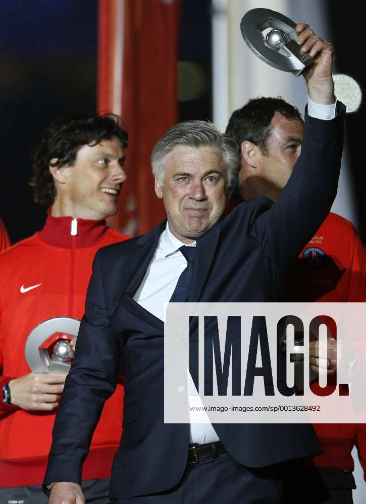 (130519) -- PARIS, 2013 (Xinhua) -- Paris Saint-Germain s manager Carlo Ancelotti reacts during the celebration for winning the French League 1 title after the League 1 football match between Paris St Germain and Brest at Parc des Princes stadium in Paris on May 18, 2013. (Xinhua Wang Lili) (SP)FRANCE-PARIS-SOCCER-SAINT-GERMIAN-CHAMPION