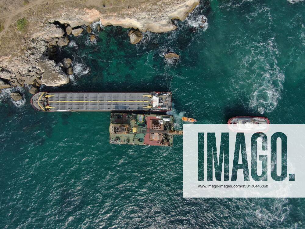 Ship disaster rock stuck Kamen brqag An aerial view of unsuccessful salvage operation of the cargo ship Vera Su which got stuck on at the rock black sea cost of the village of Kamen brqag , Bulgaria some 450 kms 260 miles north east of the capital Sofia . There are not injured persons reported on board, but the cargo of nitrogen fertilizers is danger for the environment. Kamen Brqag Bulgaria pressgroup-bulgaria210930_npLaN