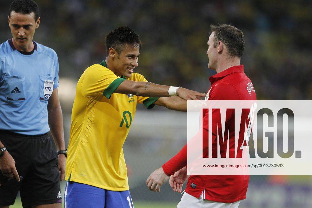 Brazil s Neymar (C) gestures to England s Wayne Rooney (R) during their friendly soccer match in Rio de Janeiro, Brazil, on June 2, 2013. The match ended with a 2-2 draw. (Xinhua Wildes Barbosa Agencia Estado) (rt) (sp) BRAZIL OUT (SP)BRAZIL-RIO DE JANEIRO-SOCCER-FRIENDLY MATCH