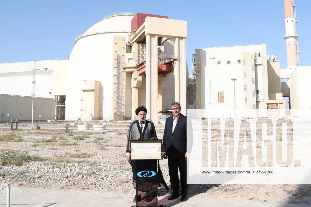 A handout photo made available by the presidential office shows Iranian President EBRAHIM RAISI (L) and head of Iran s Atomic Organisation MOHAMMAD ESLAMI (R) speaking to media during a visit at Bushehr nuclear power plant, in the city of Bushehr, southern of Iran, 08 October 2021. According to the presidential official website, Raisi said Iran s policy and the aim are using nuclear technology peacefully and will not give up in reference to tension with the US over nuclear talks. Bushehr Iran - ZUMAi98_ 20211008_zih_i98_008