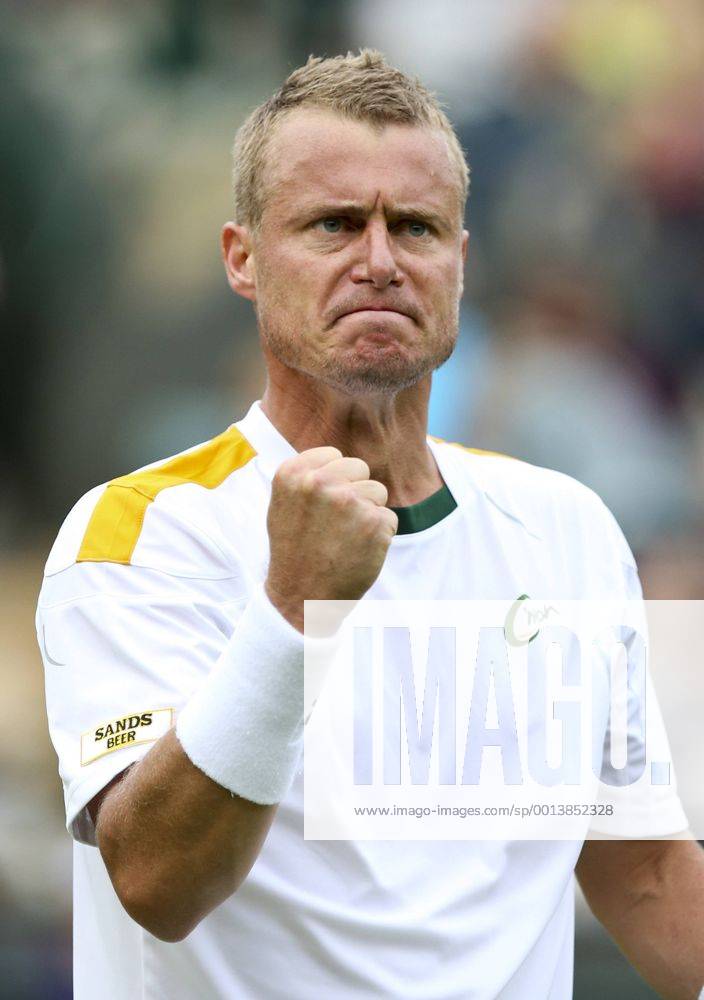 Lleyton Hewitt of Australia celebrates during the first round of the men s singles at the Wimbledon Lawn Tennis Championships in the All England Lawn Tennis and Croquet Club in London, Britain, on June 24, 2013. (Xinhua Tang Shi) (SP)BRITAIN-LONDON-TENNIS-WIMBLEDON