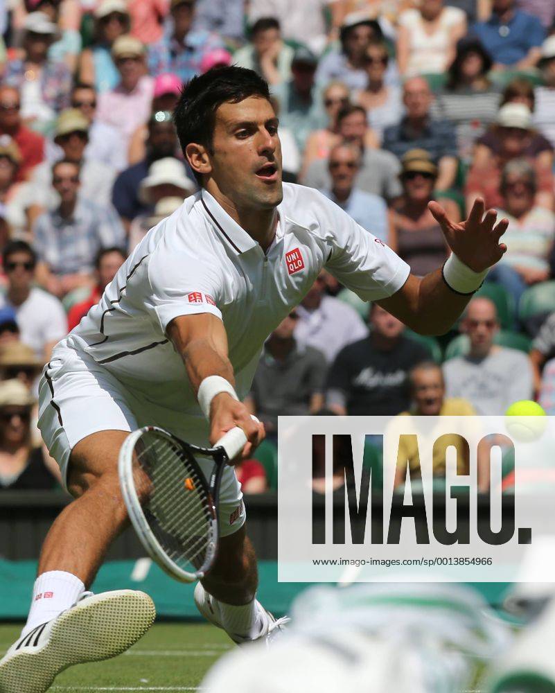 (130625) -- LONDON, June 25, 2013 (Xinhua) -- Novak Djokovic of Serbia returns a hit during the gentlemen s singles first round on day 2 of the Wimbledon Lawn Tennis Championships at the All England Lawn Tennis and Croquet Club in London, Britain on June 25, 2013. (Xinhua Yin Gang) (SP)BRITAIN-LONDON-TENNIS-WIMBLEDON-DAY 2