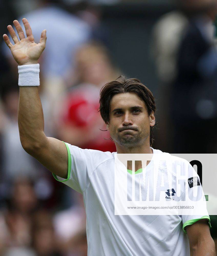 David Ferrer of Spain greets spectators after the first round of men s singles on day 2 of the Wimbledon Lawn Tennis Championships at the All England Lawn Tennis and Croquet Club in London, Britain, on June 25, 2013.