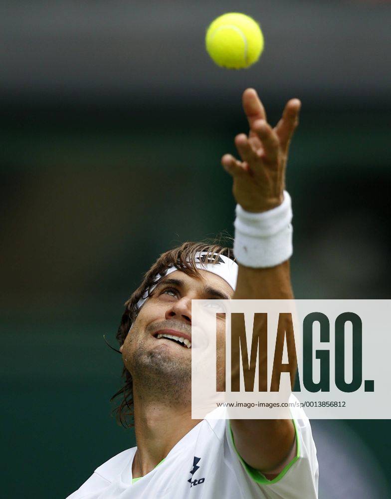 David Ferrer of Spain serves during the first round of men s singles on day 2 of the Wimbledon Lawn Tennis Championships at the All England Lawn Tennis and Croquet Club in London, Britain, on June 25, 2013.