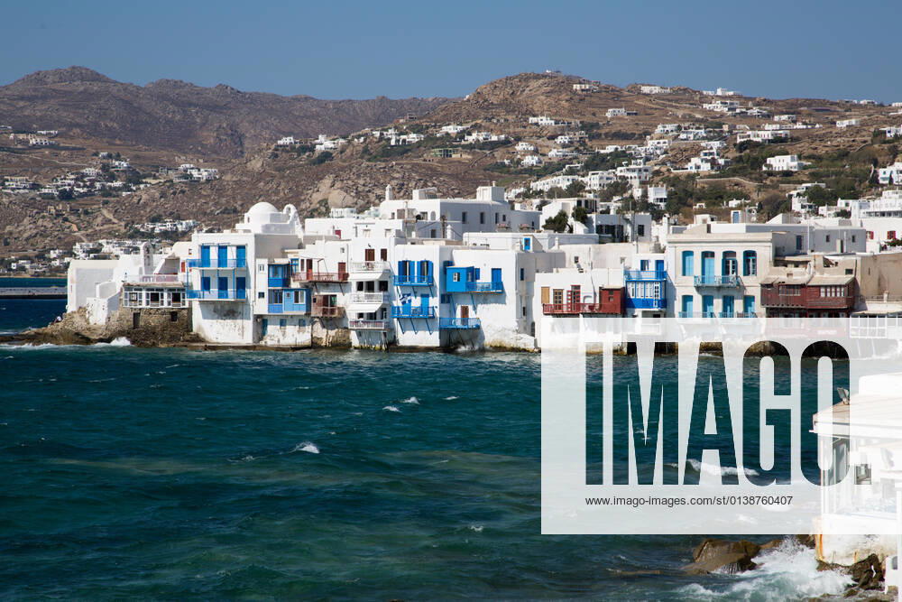 View from the sea of the famous Mykonos houses View from the sea of the famous Mykonos wind mills