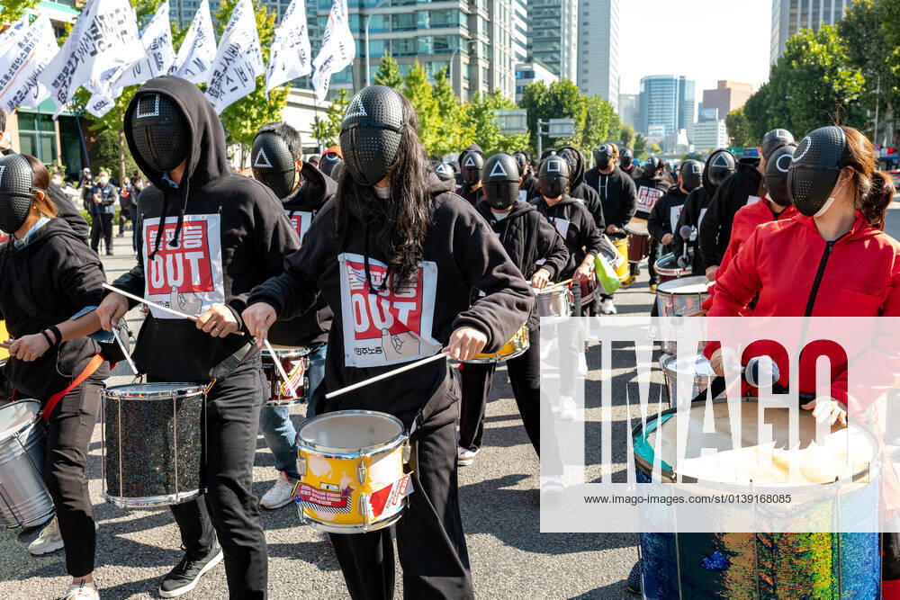 General Strike Of The Korean Confederation Of Trade Unions In Seoul Members of the Korean Confederation of Trade Unions wear masks costumed in the Netflix series Squid Game for a march to Seoul City hall during a rally against the government s labor policy on October 20, 2021 in Seoul, South Korea. Thousands of union members hold a massive rally in Seoul as an one-day strike aimed at bringing labor issues to the next presidential election in 2022. Seoul South Korea