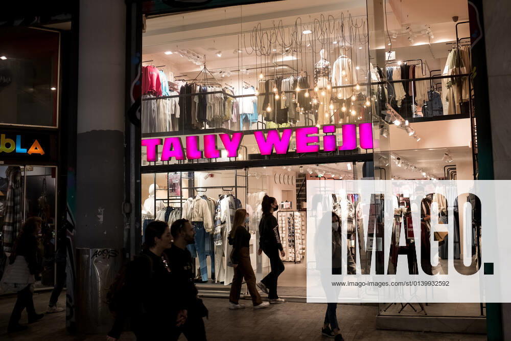 Saturday Afternoon In The Center Of Athens A Tally Weijl store. Thousands of people are shopping on Saturday afternoon, in Ermou Street in the center of Athens, Greece on October 23, 2021. Athens Greece