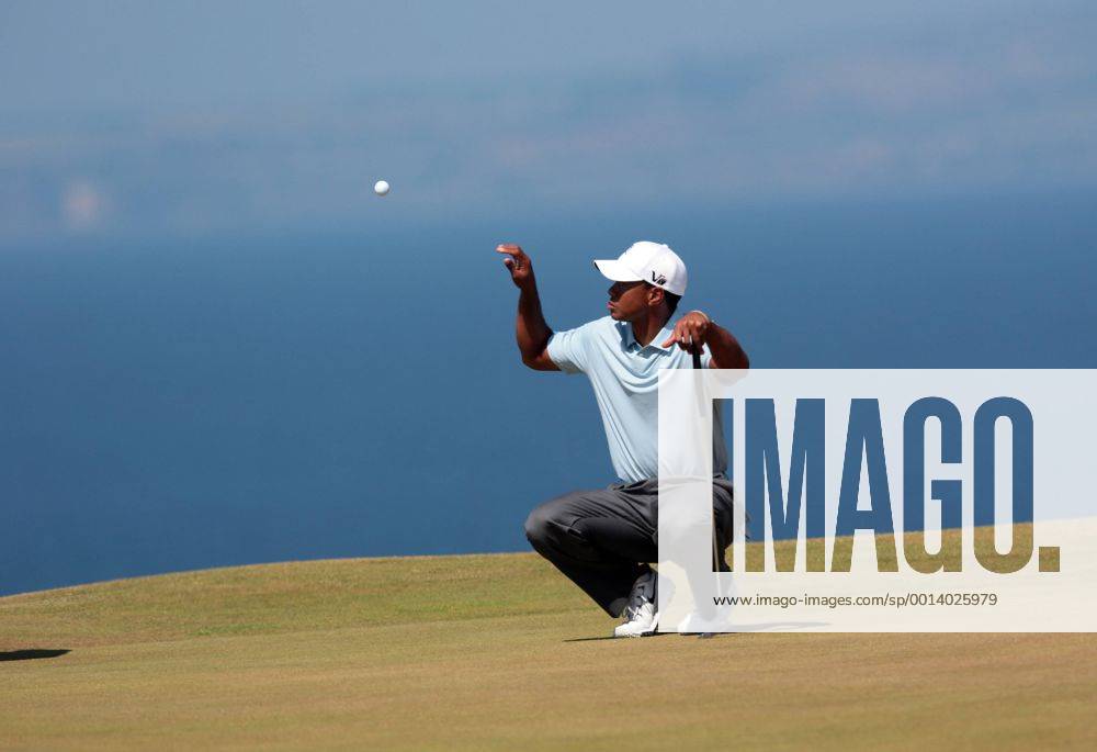 USA s Tiger Woods catches a ball on the 11th green on the second day of the 2013 Open Championship in Muirfield, Scotland on July 19 , 2013. LON2013071928
