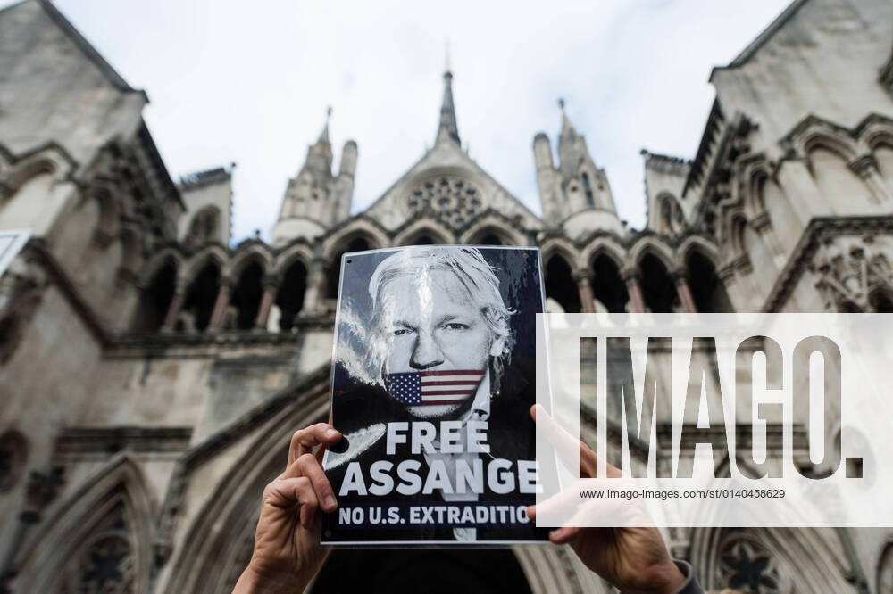 Julian Assange At The Royal Courts Of Justice Supporters of Wikileaks founder Julian Assange protest outside the Royal Courts of Justice, in London, Britain, 28 October 2021. The US government is appealing against a British judge s decision to block the extradition of WikiLeaks founder Julian Assange to face trial for publishing military secrets. Assange, 50, was arrested in Britain in 2019 for jumping bail after spending seven years inside the Ecuadorian embassy to avoid extradition to Sweden where he faced allegations of sexual assault. These were later dropped. Despite his extradition being blocked, he has been denied bail pending the outcome of the US appeal, amid fears he would abscond. London United Kingdom