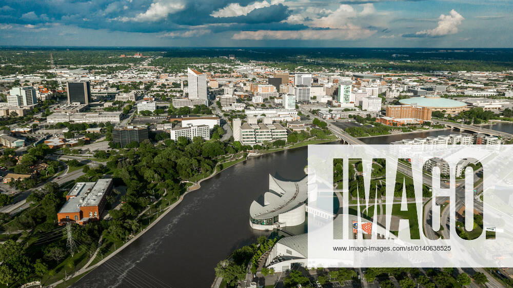 Drone aerial view of downtown Wichita Skyline, Kansas features Exploration Place on Arkansas River. copyrightxjoexsohmx2021xallxrightsxreserved 929_14_voahd-80-652