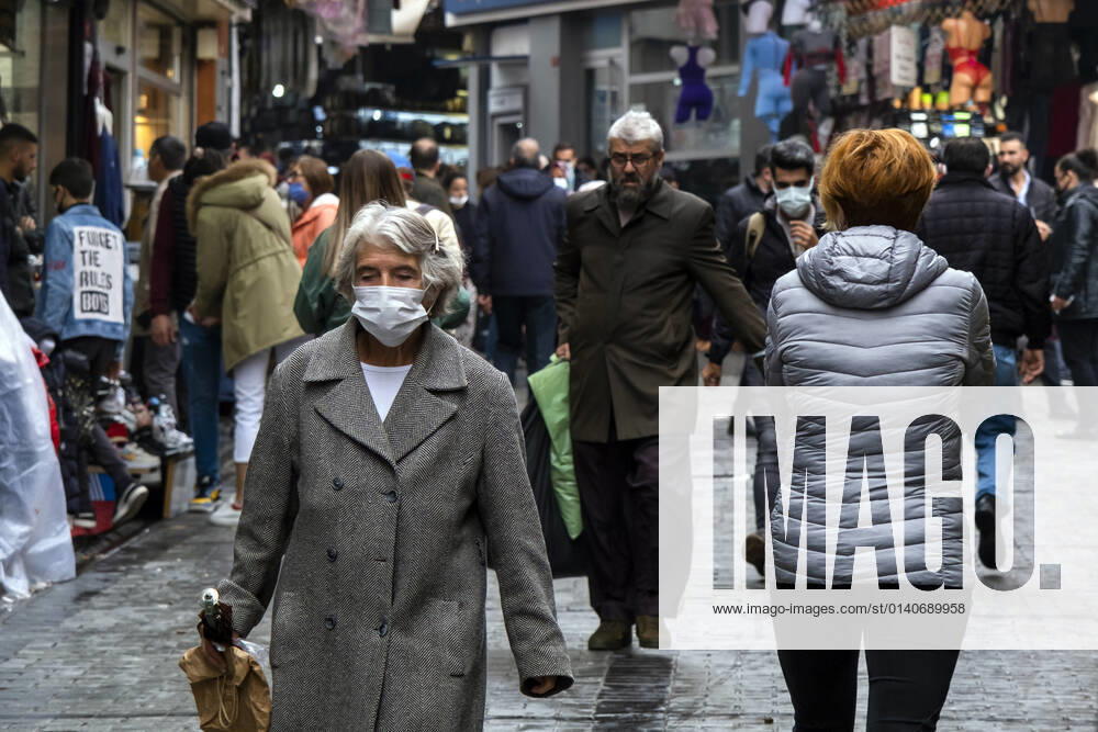 People wearing face masks walk on a street in Istanbul, Turkey, on November 1, 2021. Turkey confirmed 28,678 new COVID-19 cases, raising its tally of infections to 8,061,666 according to its health ministry. Some 217 persons died of Covid-9 today, increasing the death toll from the virus in Turkey to 70,828. (