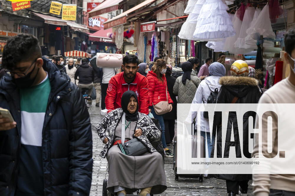 People wearing face masks walk on a street in Istanbul, Turkey, on November 1, 2021. Turkey confirmed 28,678 new COVID-19 cases, raising its tally of infections to 8,061,666 according to its health ministry. Some 217 persons died of Covid-9 today, increasing the death toll from the virus in Turkey to 70,828. (