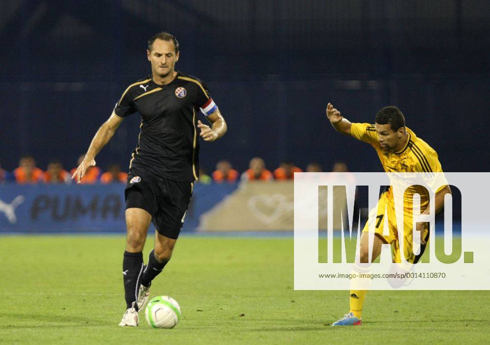 Zagreb, 30.7.2013. - UEFA Champions League 2013 2014, Third Qualifying Round, Stadium Maksimir. GNK Dinamo (blue) - FC Sheriff (yellow). Josip Simunic vs Ricardo Cavalcante Mendes GNK Dinamo - FC Sheriff