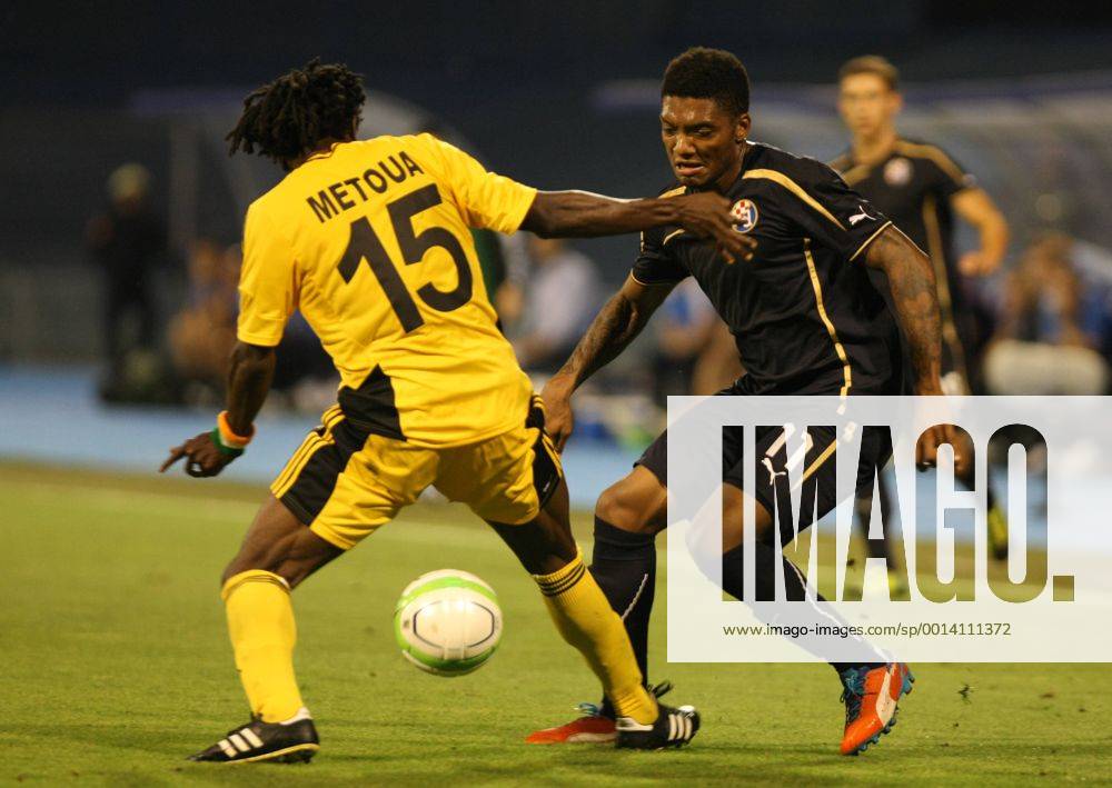 Zagreb, 30.7.2013. - UEFA Champions League 2013 2014, Third Qualifying Round, Stadium Maksimir. GNK Dinamo Zagreb (blue) - FC Sheriff Tiraspol (yellow). Junior Fernandes vs Kpamin Kouegbe Marcel Metoua GNK Dinamo - FC Sheriff