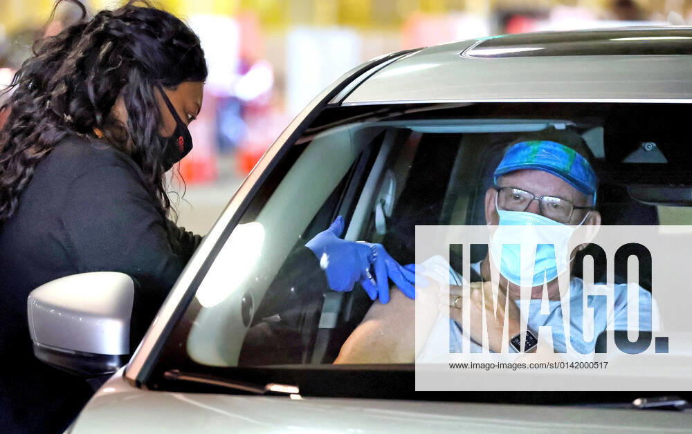 A Florida resident gets vaccinated at the drive-thru site at the Orange County Convention Center in Orlando, Monday, Feb. 22, 2021. There has been a significant increase recently of newly vaccinated Floridians in the Latino and youth demographics. Orlando USA - ZUMAm67_ 20210222_zaf_m67_086