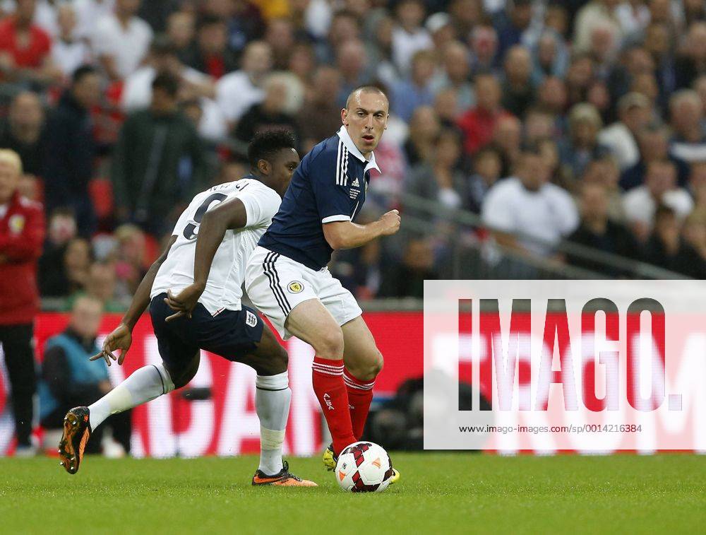 England s Danny Welbeck gets tackled by Scotland s Scott Brown England v Scotland - International Friendly - Wembley - London - England -14 08 2013 - Pic DavidxKlein Sportimage .