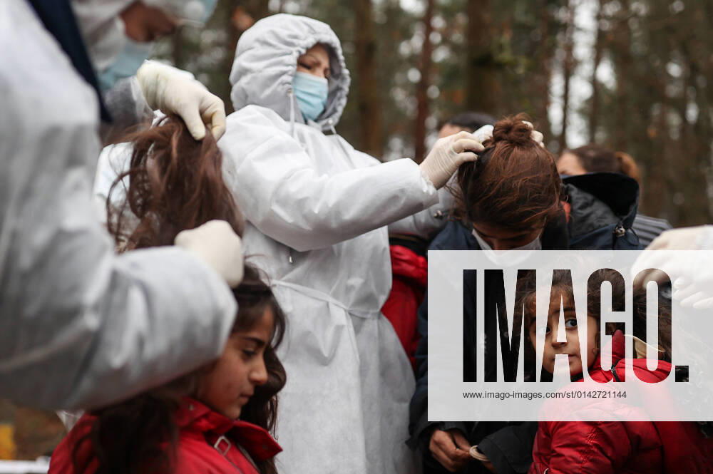 Migrants are seen ahead of taking a sauna by the Bruzgi Transport and Logistics Centre, some 1.5 km northeast of Kuznica Bialostocka-Bruzgi border crossing on the Belarusian-Polish border. The migrant crisis on the border of Belarus with Poland, Lithuania, and Latvia escalated on November 8. This year, Polish border guards have prevented more than 35,000 attempts to illegally cross the Polish-Belarusian border, which is 400 times more than last year. Sergei Bobylev TASS TS11922A