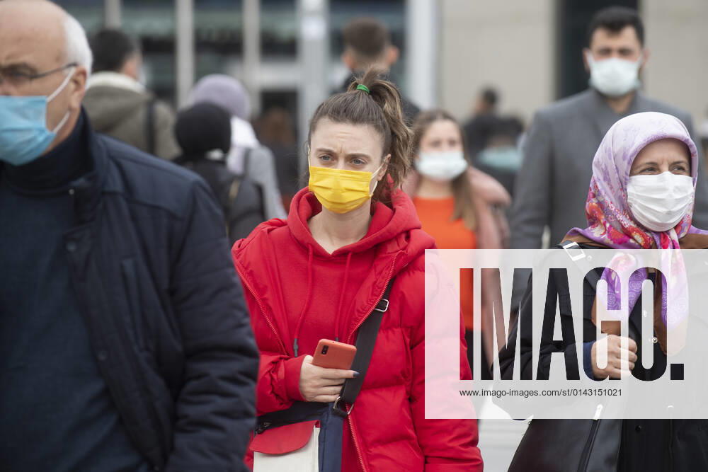 People wearing face masks walk on a street in Ankara, Turkey, on November 28, 2021. Turkey confirmed 21,655 new COVID-19 cases, raising its tally of infections to 8,746,055 according to its health ministry. Some 213 persons died of Covid-9 today, increasing the death toll from the virus in Turkey to 76,446. (
