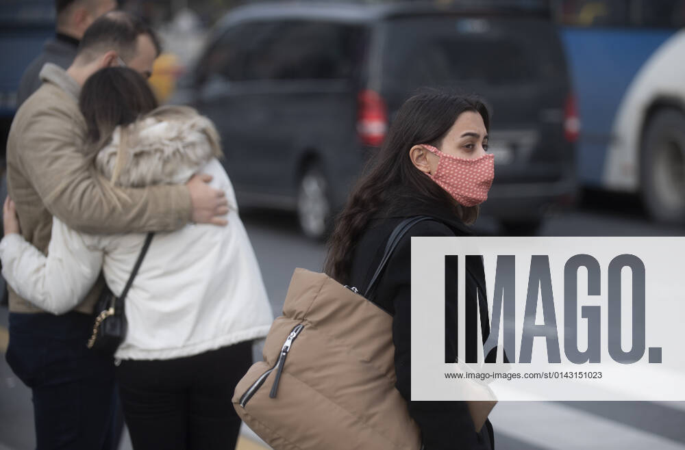 People wearing face masks walk on a street in Ankara, Turkey, on November 28, 2021. Turkey confirmed 21,655 new COVID-19 cases, raising its tally of infections to 8,746,055 according to its health ministry. Some 213 persons died of Covid-9 today, increasing the death toll from the virus in Turkey to 76,446. (