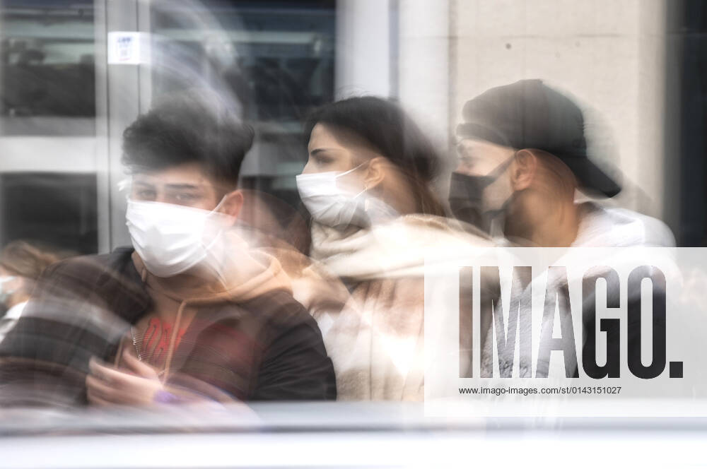 People wearing face masks walk on a street in Ankara, Turkey, on November 28, 2021. Turkey confirmed 21,655 new COVID-19 cases, raising its tally of infections to 8,746,055 according to its health ministry. Some 213 persons died of Covid-9 today, increasing the death toll from the virus in Turkey to 76,446. (