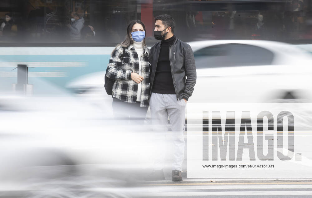 People wearing face masks walk on a street in Ankara, Turkey, on November 28, 2021. Turkey confirmed 21,655 new COVID-19 cases, raising its tally of infections to 8,746,055 according to its health ministry. Some 213 persons died of Covid-9 today, increasing the death toll from the virus in Turkey to 76,446. (