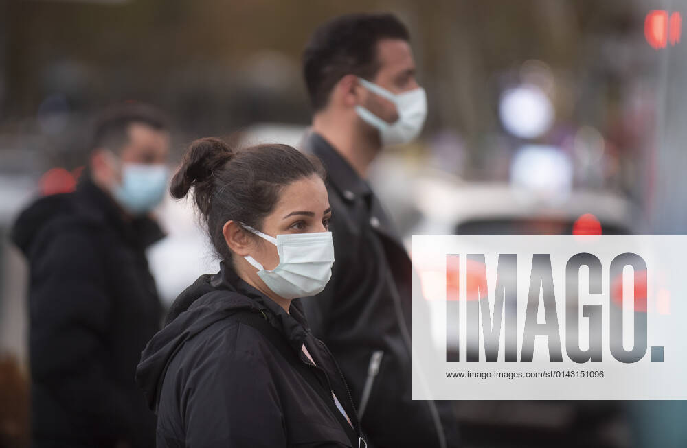 People wearing face masks walk on a street in Ankara, Turkey, on November 28, 2021. Turkey confirmed 21,655 new COVID-19 cases, raising its tally of infections to 8,746,055 according to its health ministry. Some 213 persons died of Covid-9 today, increasing the death toll from the virus in Turkey to 76,446. (