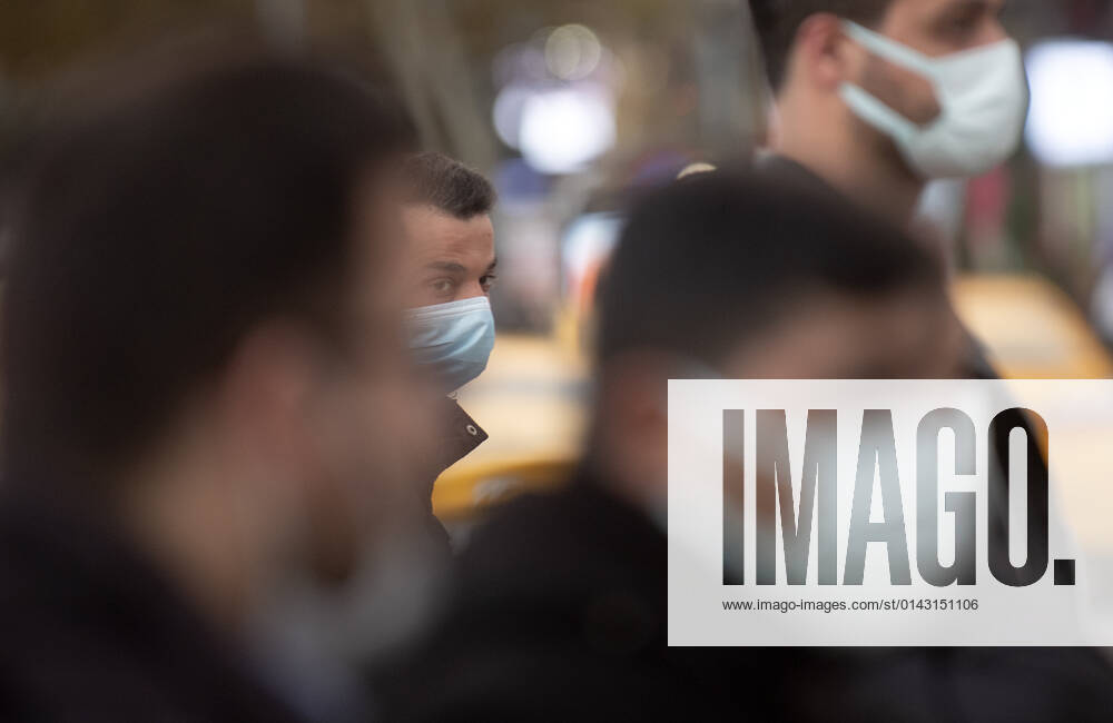 People wearing face masks walk on a street in Ankara, Turkey, on November 28, 2021. Turkey confirmed 21,655 new COVID-19 cases, raising its tally of infections to 8,746,055 according to its health ministry. Some 213 persons died of Covid-9 today, increasing the death toll from the virus in Turkey to 76,446. (