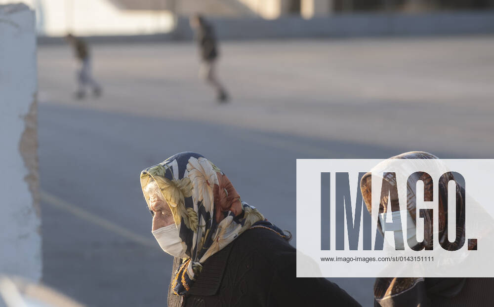 People wearing face masks walk on a street in Ankara, Turkey, on November 28, 2021. Turkey confirmed 21,655 new COVID-19 cases, raising its tally of infections to 8,746,055 according to its health ministry. Some 213 persons died of Covid-9 today, increasing the death toll from the virus in Turkey to 76,446. (
